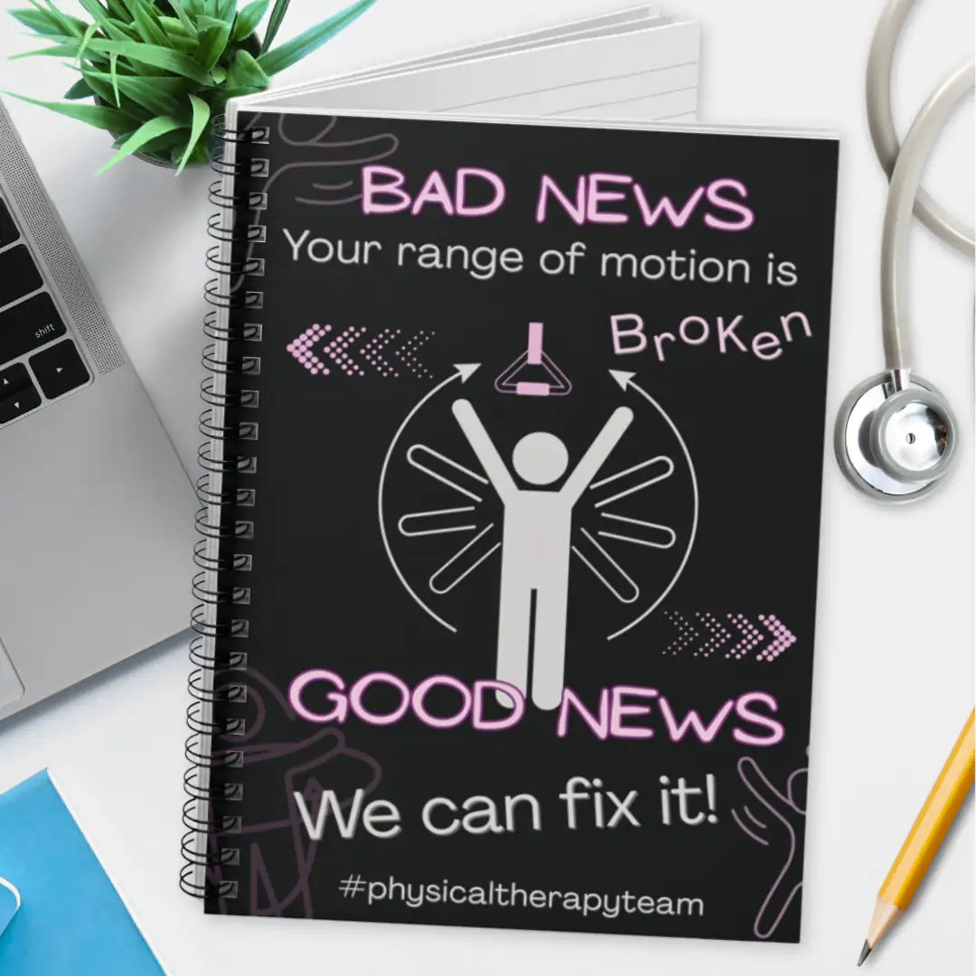 Spiral notebook with physical therapy message 'Bad news your range of motion is broken, good news we can fix it' text on a desk with laptop, stethoscope, and pencil.