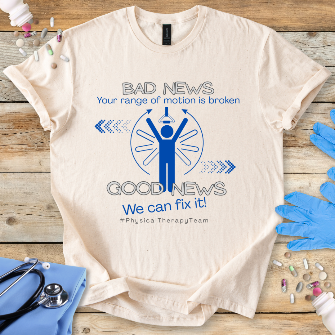 Beige t-shirt with physical therapy-themed graphic and 'Your range of motion is broken' text on a wooden surface with medical items.