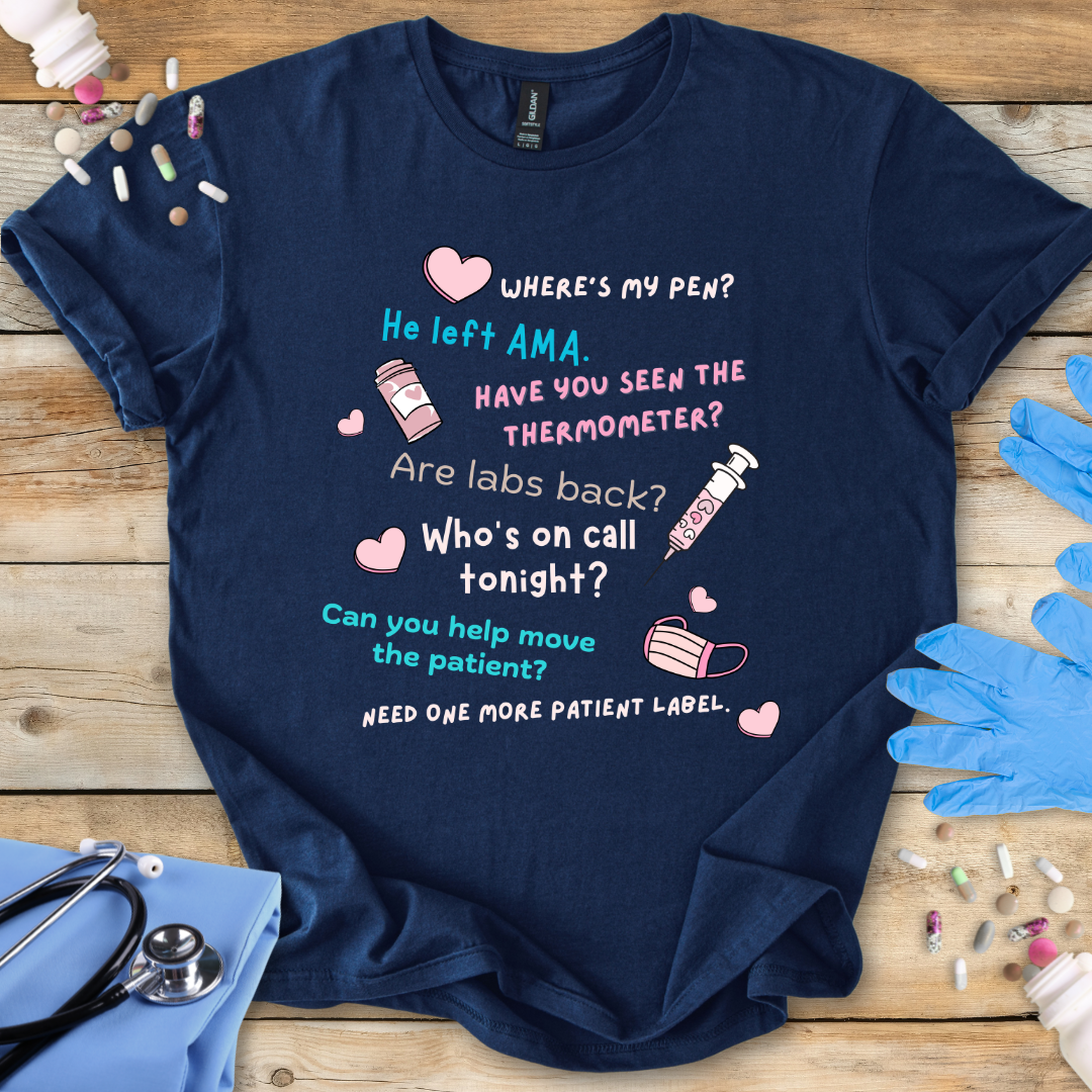Navy blue t-shirt with humorous medical-themed text on a wooden surface with medical accessories.