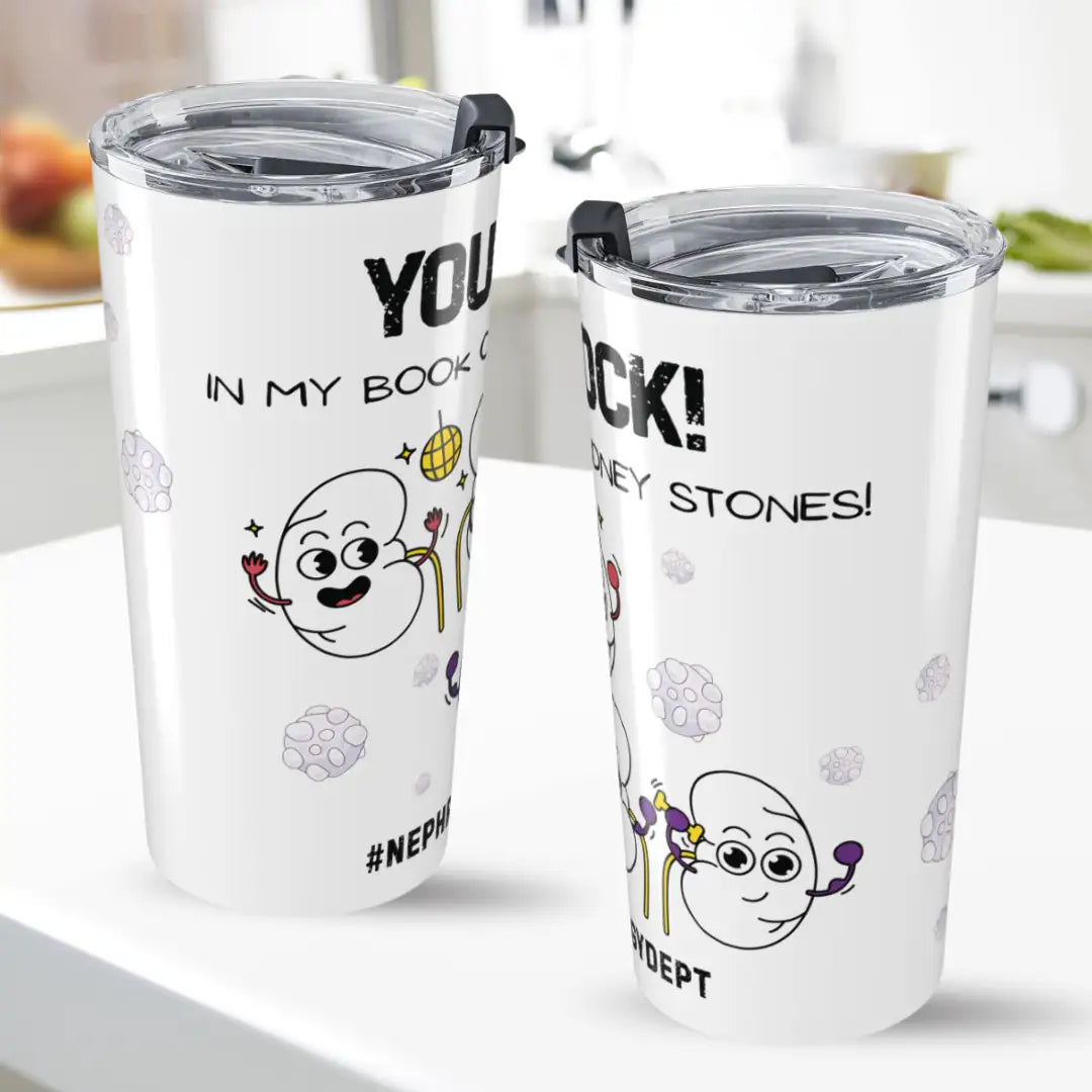 Two white tumblers with humorous kidney designs and text on a white surface.