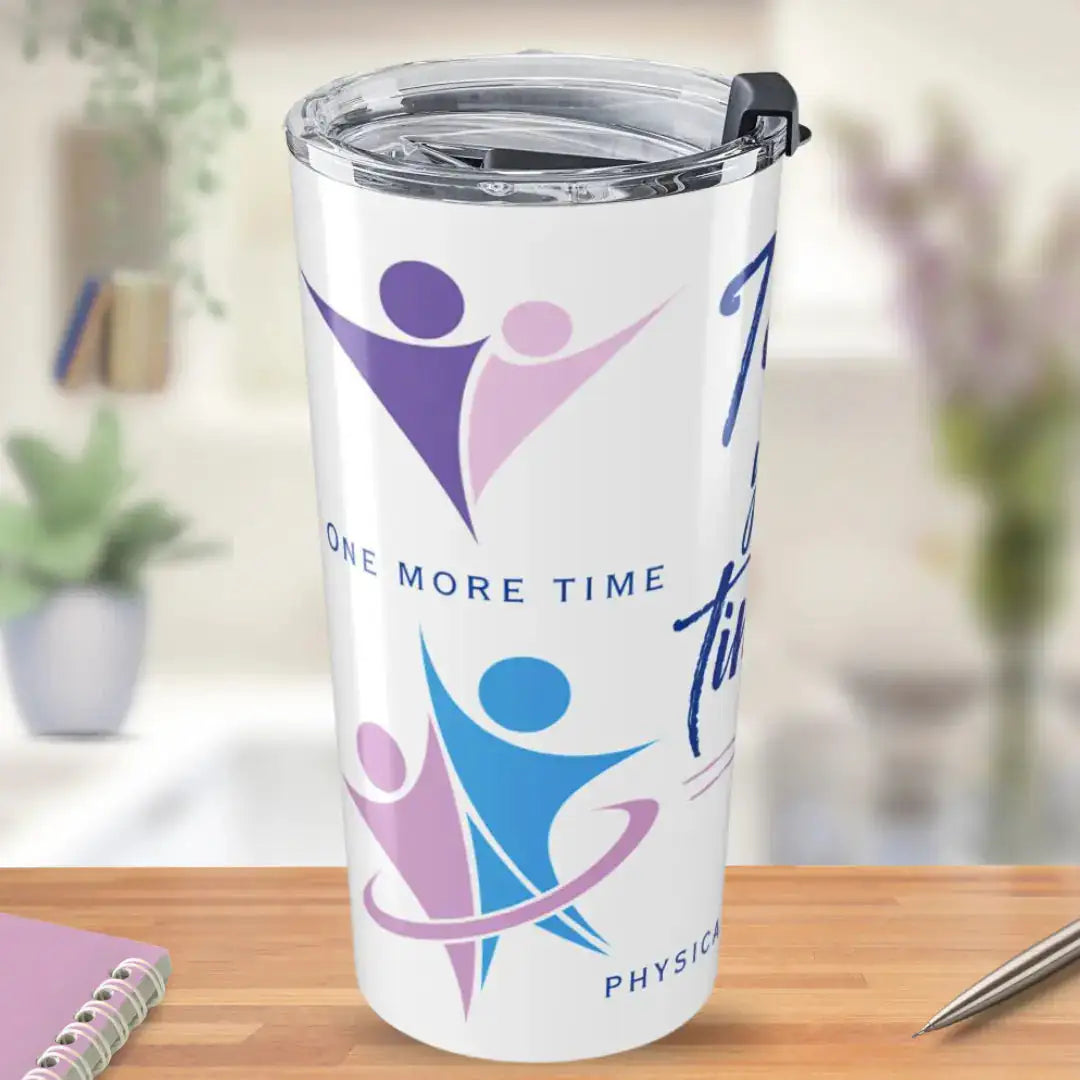 White stainless steel tumbler with 'One More Time' text and colorful purple, pink, and blue dynamic figure graphics representing physical therapy movement, on a blurred home background.