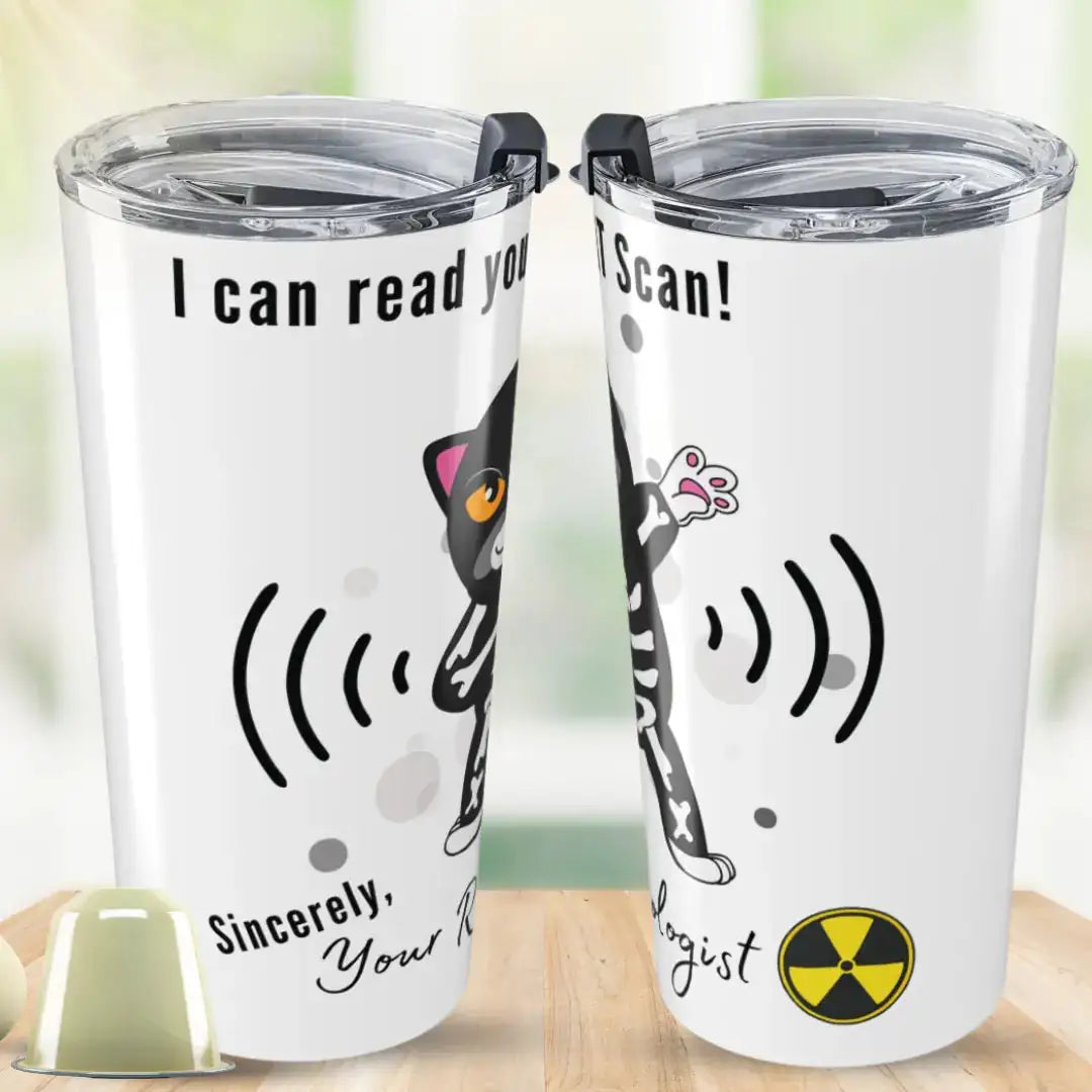 Two white stainless steel tumblers showing front and back views with 'I Can Read Your CAT Scan! Sincerely, Your Radiologist' text, featuring a dabbing skeleton cat graphic and radiation symbol, on a wooden desk background.