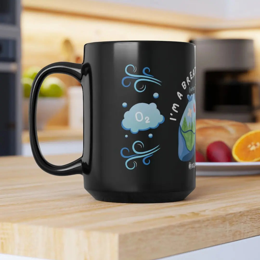 Black mug with air design on a wooden surface