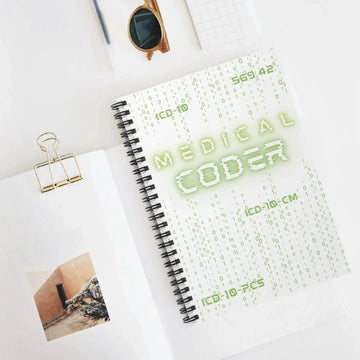 Medical Coder Notebook Matrix coding design on a white desk