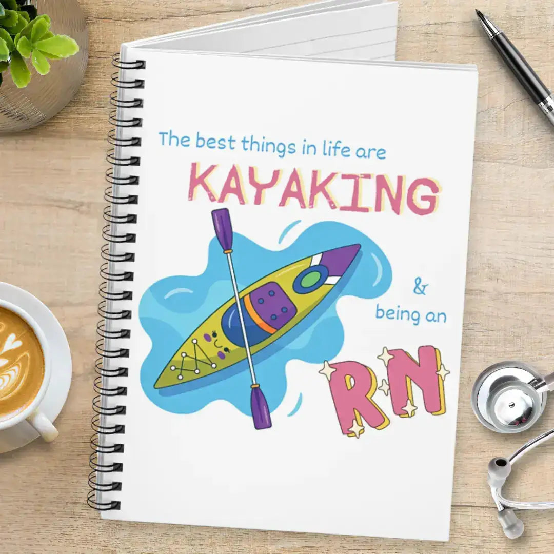 White medical humor spiral notebook with a kayak design and the text' The  best things in life are Kayaking & being an RN