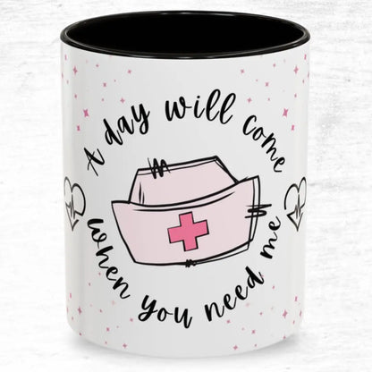 Mug with a nurse's hat design and 'A Day Will Come When You Need Me' text on a white background