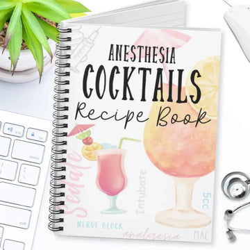 Medical spiral notebook titled 'Anesthesia Cocktails' on a desk with a laptop and stethoscope.