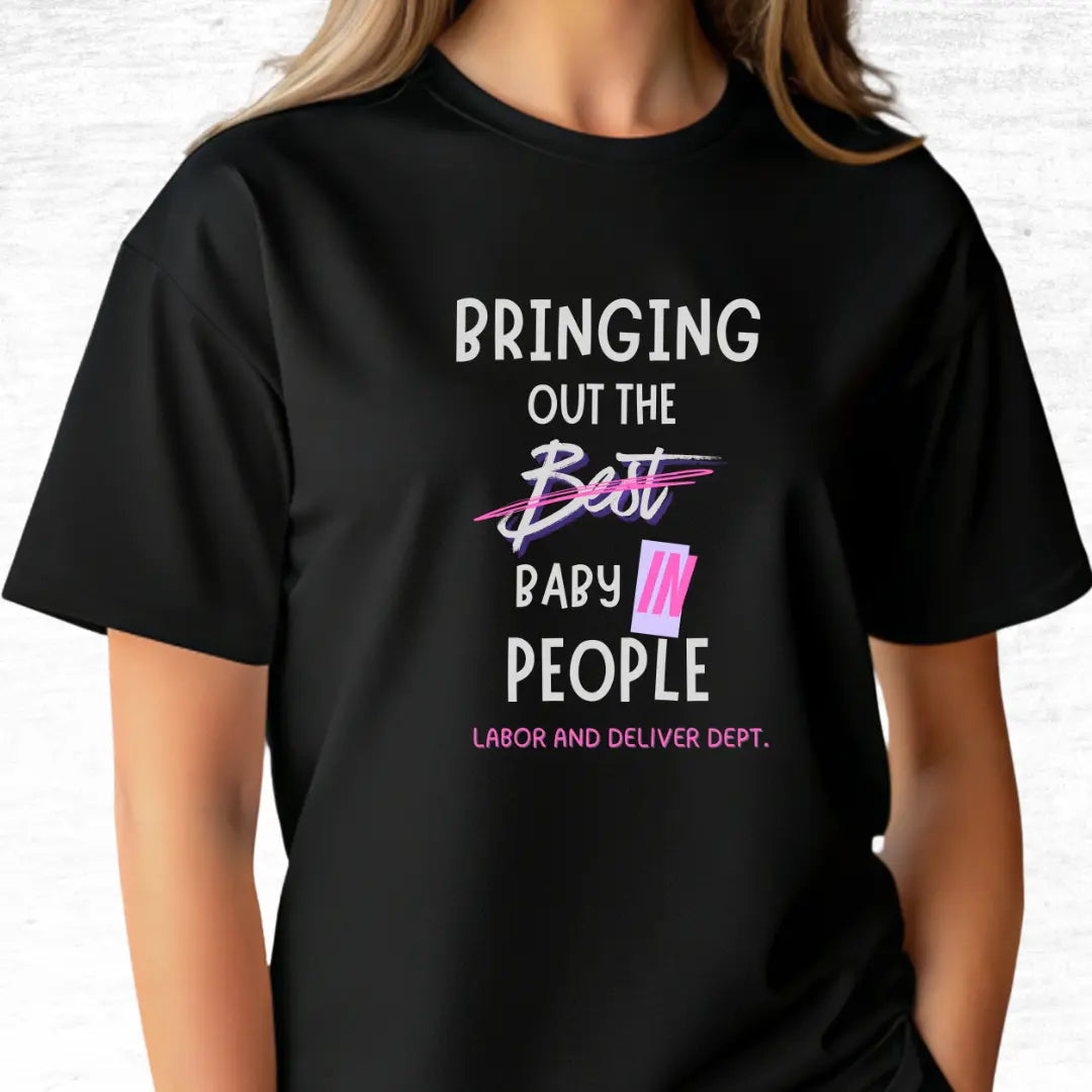 Black labor and delivery t-shirt with humorous 'Bringing out the baby in people' text design on a light gray background