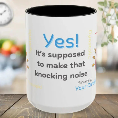 Ceramic white mug with funny 'Yes, It's Supposed To Make That Noise' text and black interior on a wooden surface