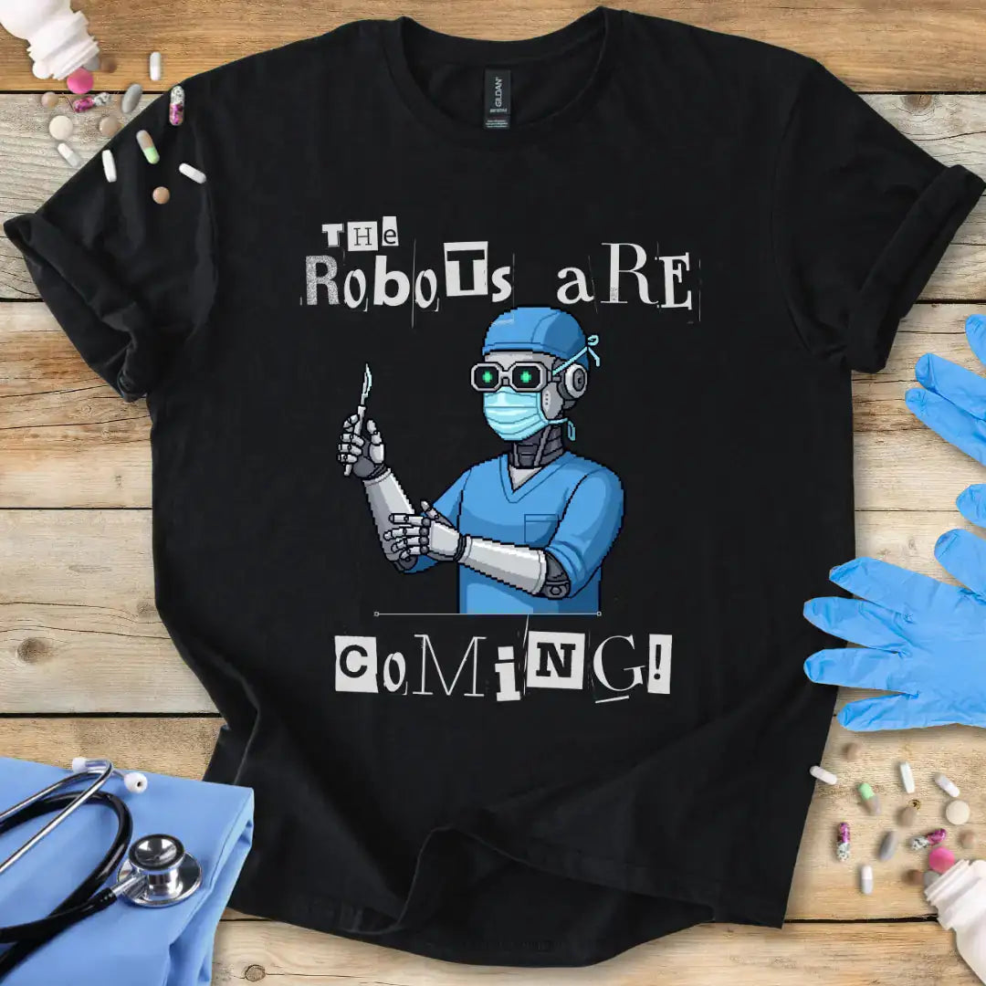 Black t-shirt with robot graphic and text 'The Robots are Coming!' on a wooden surface with medical-themed items.