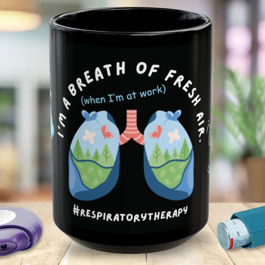 Black mug with respiratory therapist design and 'I'm A Breath Of Fresh Air' on a wooden surface