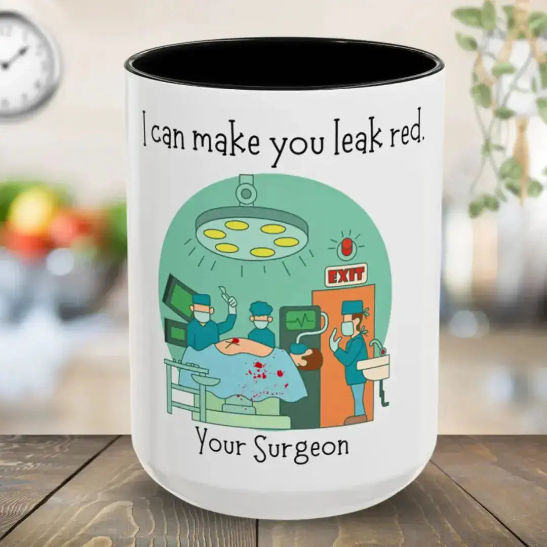 White mug with black interior, featuring a cartoon illustration of surgeons and text, on a wooden surface.