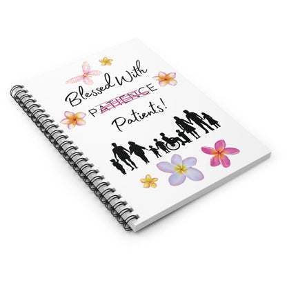 Notebook with 'Blessed With Patience Patients' text and floral designs on a white background