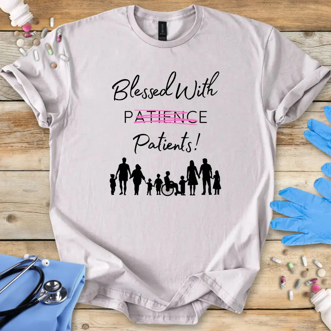 Ice-Gray medical humor t-shirt with 'Blessed With Patients not Patience!' text and family icons on a wooden surface with medical supplies.