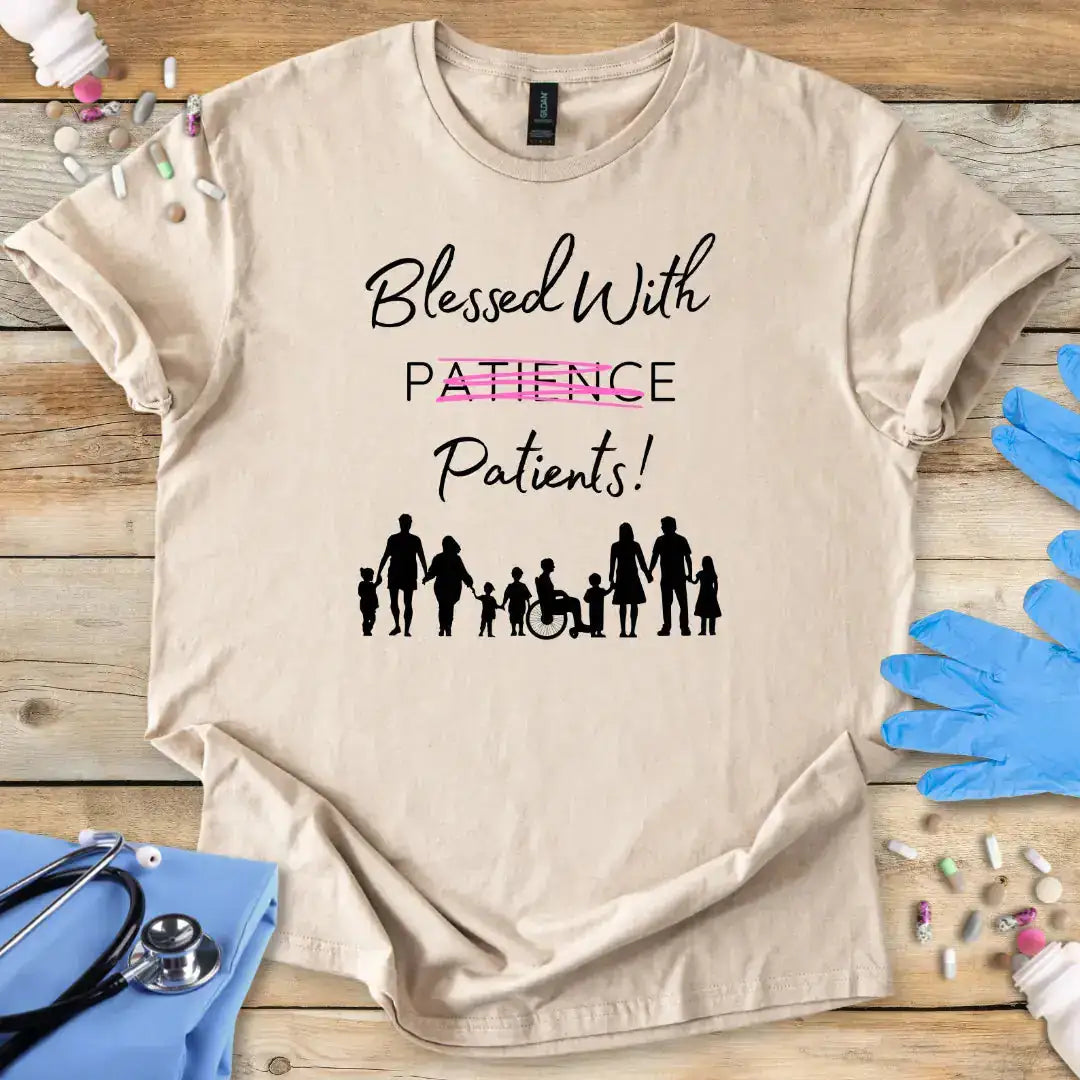 Beige t-shirt with 'Blessed With Patients Not Patience!' text and family icons on a wooden surface with medical items.