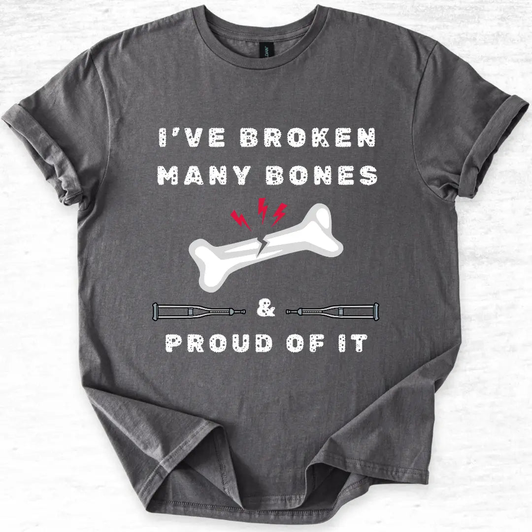 Gray t-shirt with a graphic and text 'I've broken many bones & proud of it' on a light gray background
