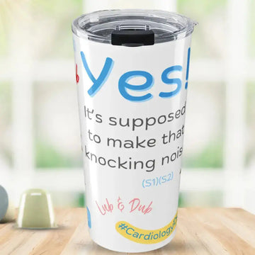 Tumbler with Yes, It's supposed to make that knocking noise' text and colorful design on a wooden surface