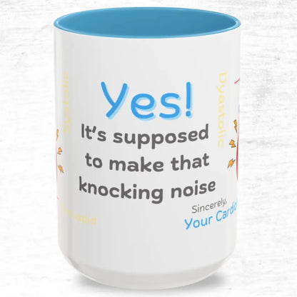 White mug with blue interior and  'Knocking Noise'  text on a white background