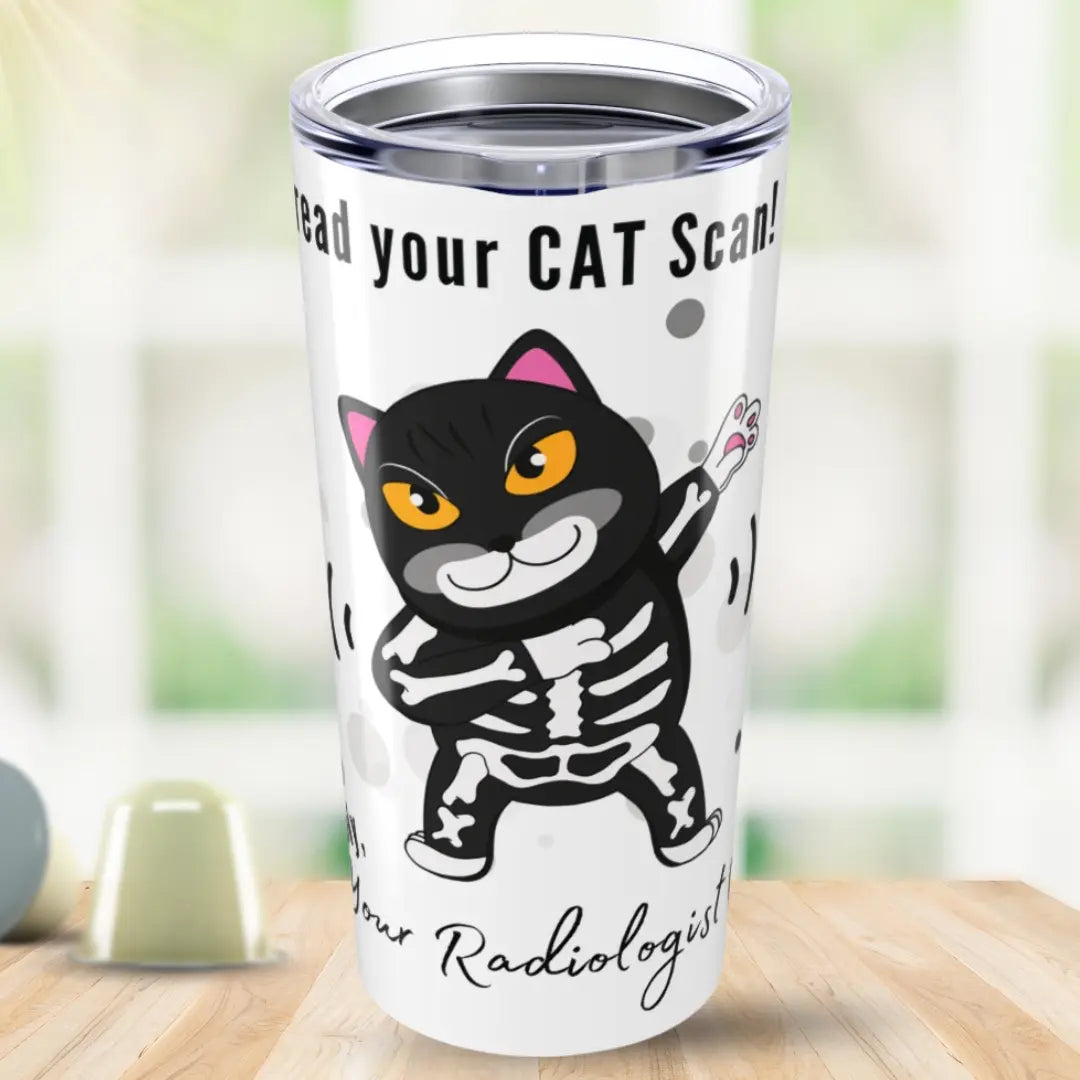 Tumbler with a cartoon cat skeleton design and 'I Can Read Your Cat Scan Your Radiologist' text on a blurred background