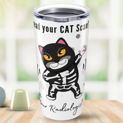 Tumbler with a cartoon cat skeleton design and 'I Can Read Your Cat Scan Your Radiologist' text on a blurred background