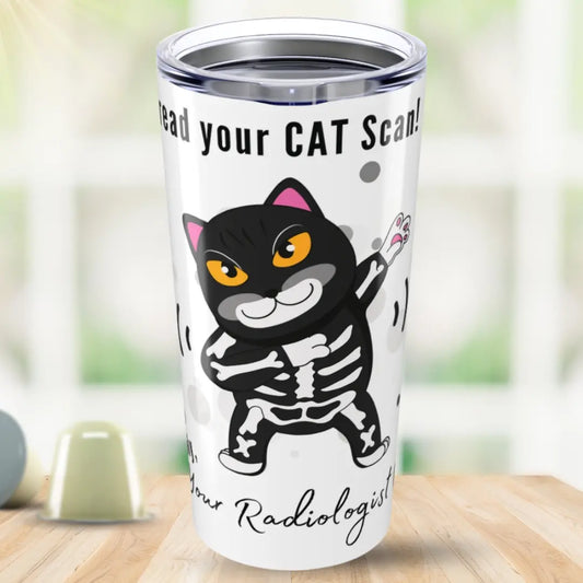 Tumbler with a cartoon cat skeleton design and 'I Can Read Your Cat Scan Your Radiologist' text on a blurred background