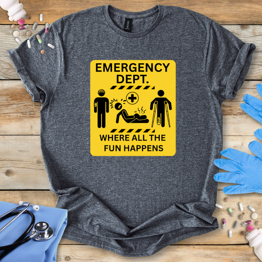 Gray t-shirt with a funny yellow emergency department sign graphic on a wooden surface with medical-themed items.
