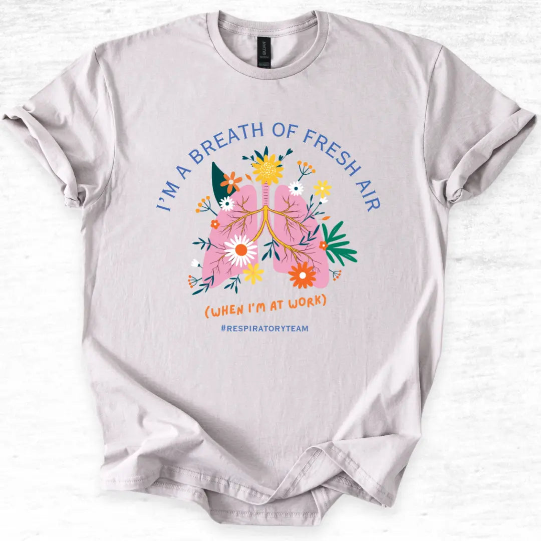 Gray t-shirt with a colorful graphic and I'm A Breath Of Fresh Air' text on a white background