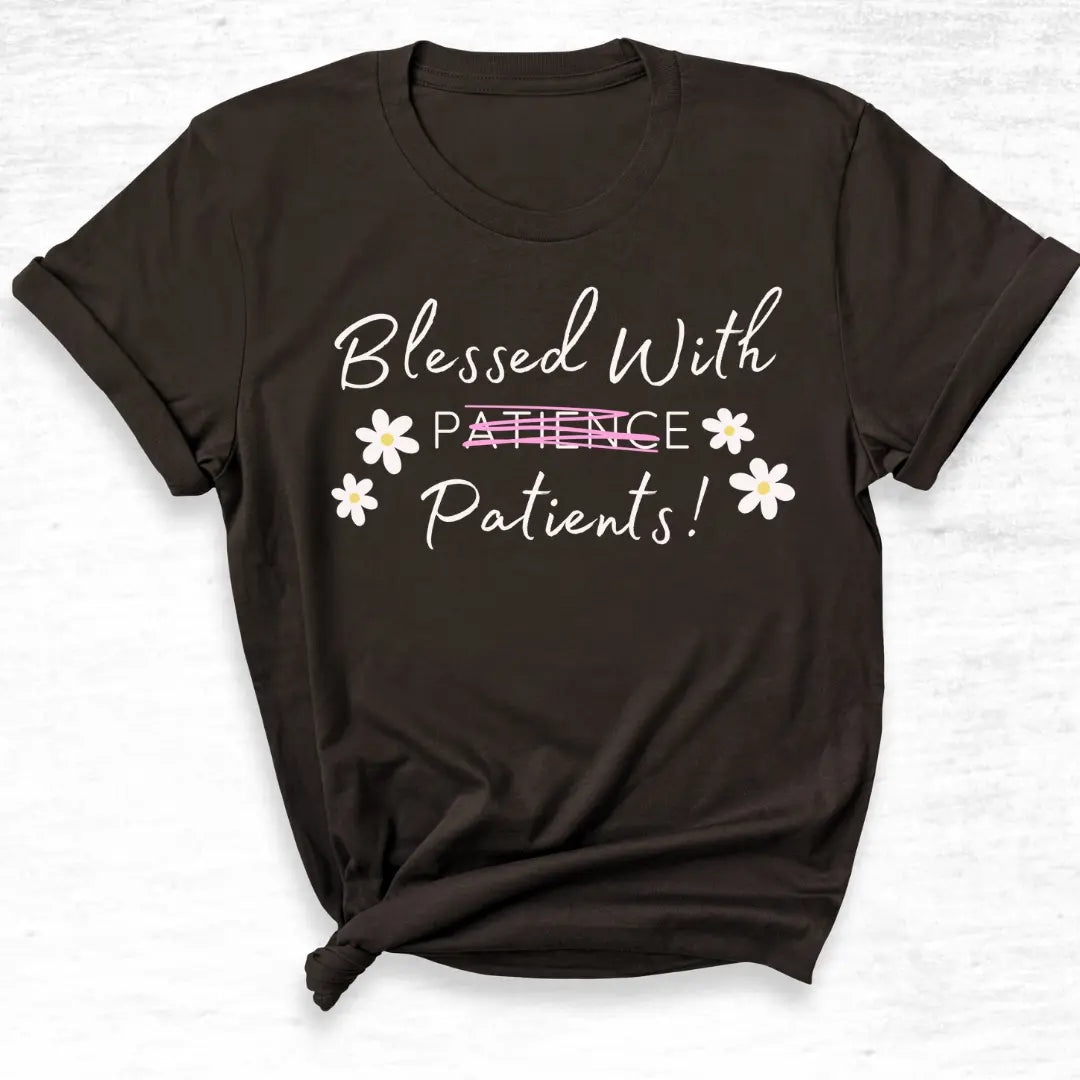 Black t-shirt with 'Blessed With Patients Not Patients!' text and flowers on a white background