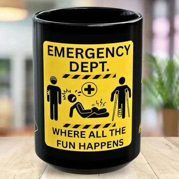 Black mug with a yellow emergency department design on a wooden surface.