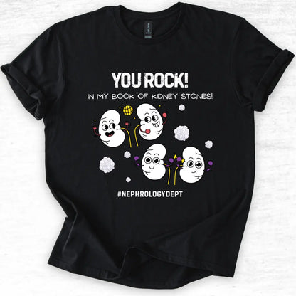 Black t-shirt with cartoon kidneys and 'You Rock In My Book Of Kidney Stones' text on a light gray background