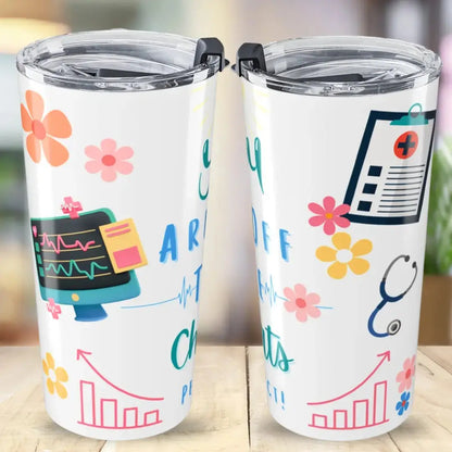Two white tumblers with colorful medical designs on a wooden surface.