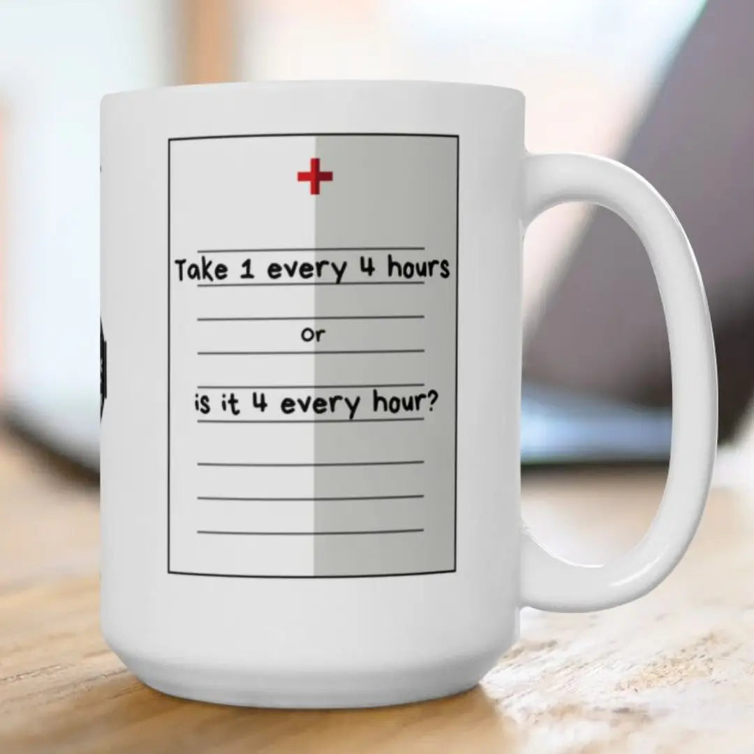 White mug with a humorous medication schedule design on a wooden surface.