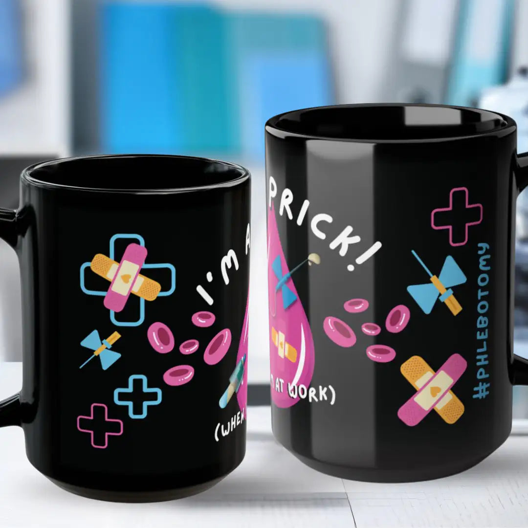Two black mugs with colorful designs and 'Phlebotomy' text on a blurred indoor background