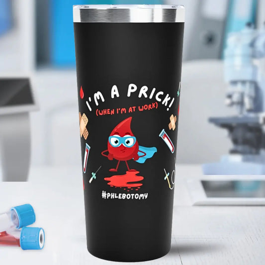 Black tumbler with a cartoon blood drop character and 'I'm A Prick When I'm At Work #Phlebotomy' text in a laboratory setting