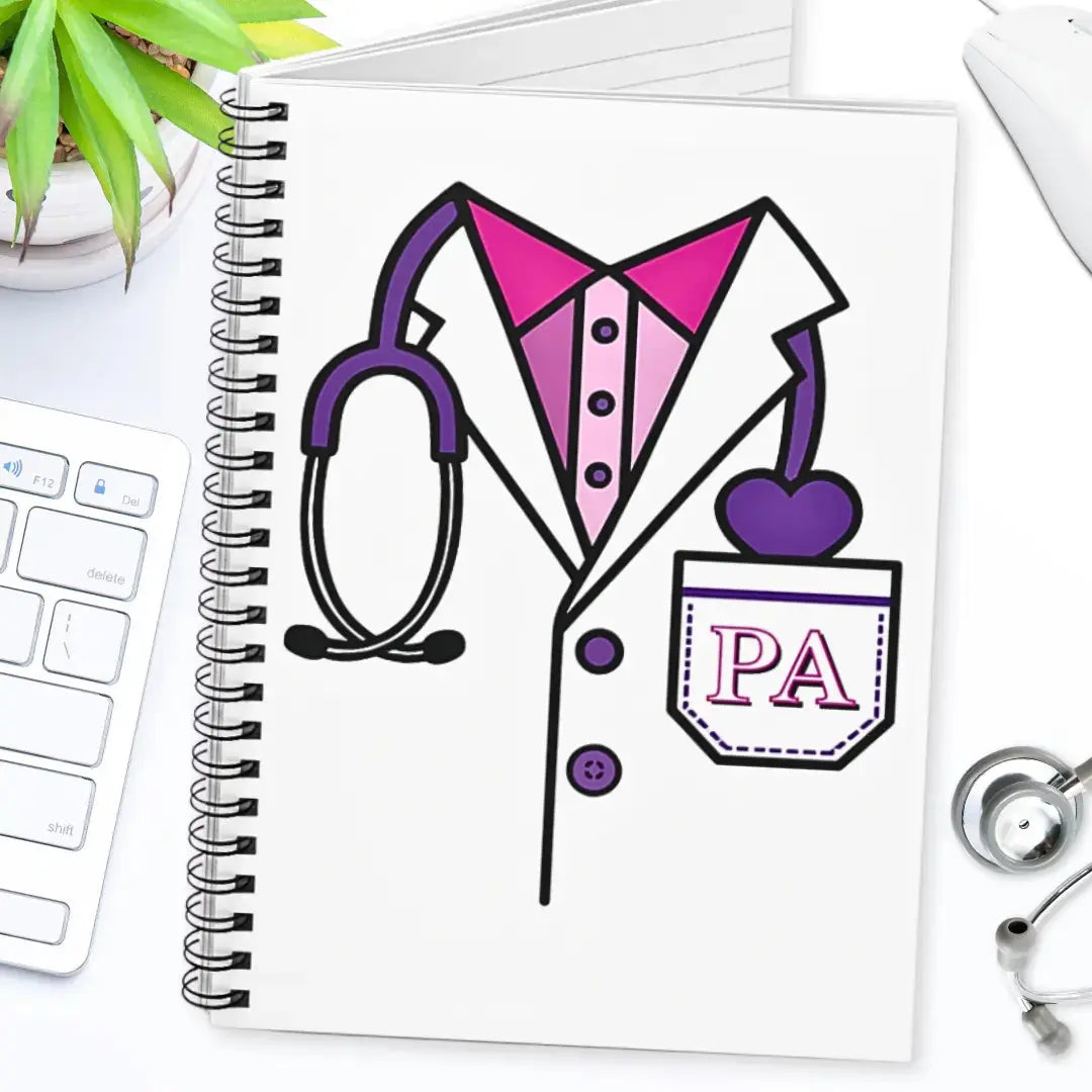 Notebook with a PA (Physician Assistant) illustration on a desk with a stethoscope and plant.