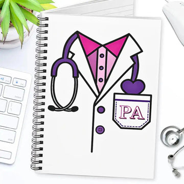 Notebook with a PA (Physician Assistant) illustration on a desk with a stethoscope and plant.