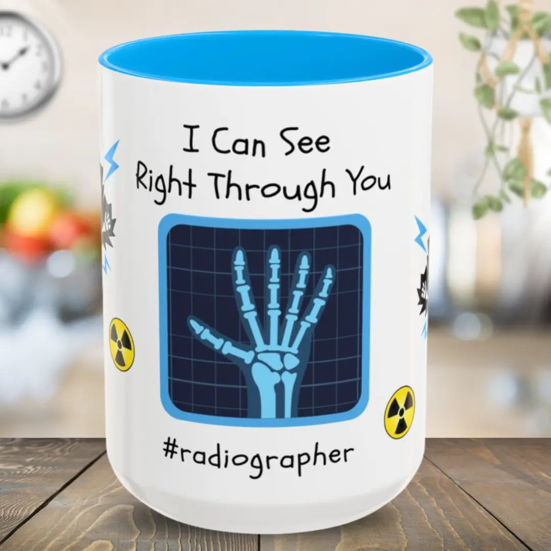 Mug with x-ray design and text 'I Can See Right Through You #radiographer' on a wooden surface.