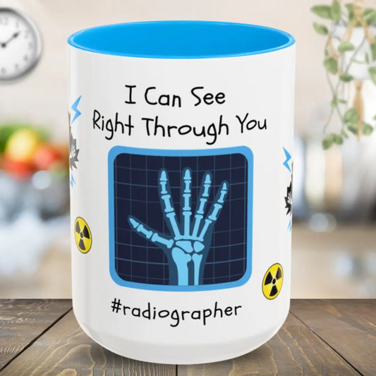 Mug with x-ray design and text 'I Can See Right Through You #radiographer' on a wooden surface.