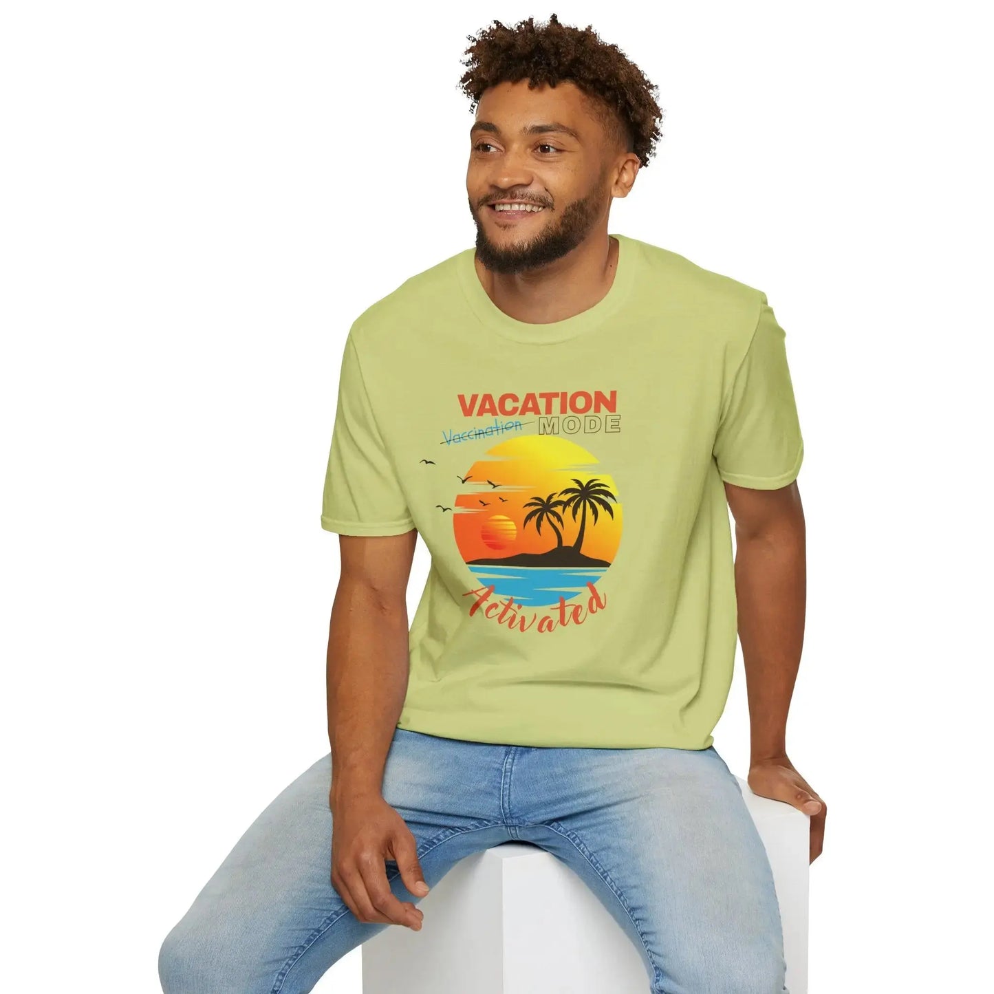 Man wearing a light green t-shirt with a 'Vacation Mode Activated' graphic design.