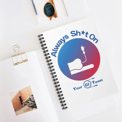 Notebook with a colonoscopy graphic design on a white surface