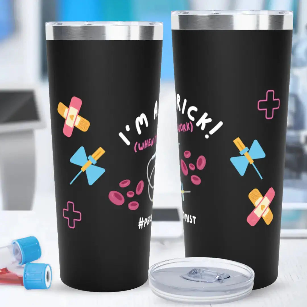 Two black stainless steel tumblers showing front and back views with 'I'm A Prick! (When I'm At Work) #Phlebotomist' text, decorated with colorful bandage, butterfly needle, red blood cell, and medical cross graphics, on a blurred laboratory background.