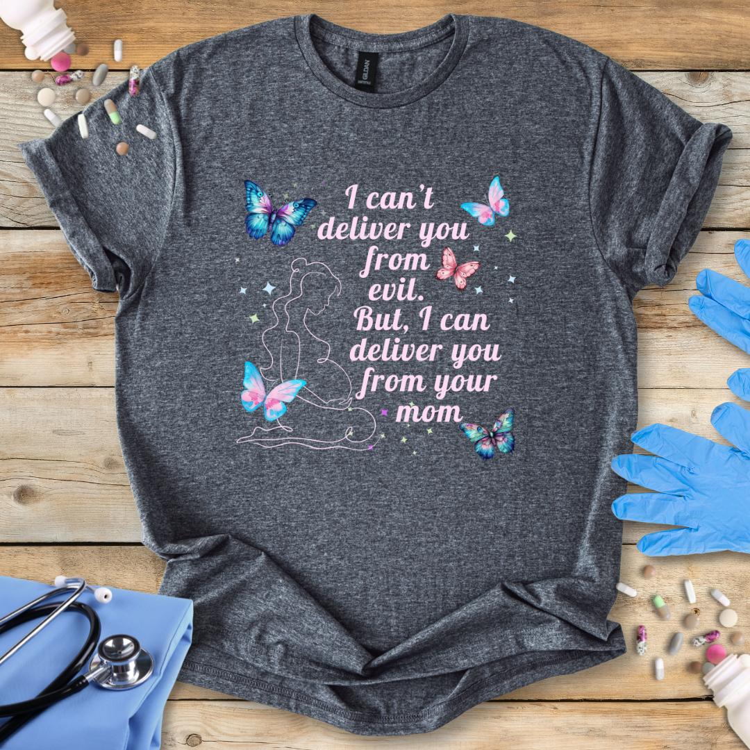 Gray t-shirt with butterfly design and humorous text on a wooden surface with medical supplies.