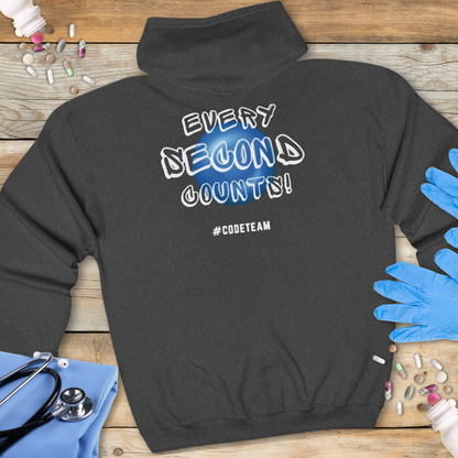Dark Heather Grey hoodie with 'Every Second Counts!' text on a wooden surface with medical supplies.