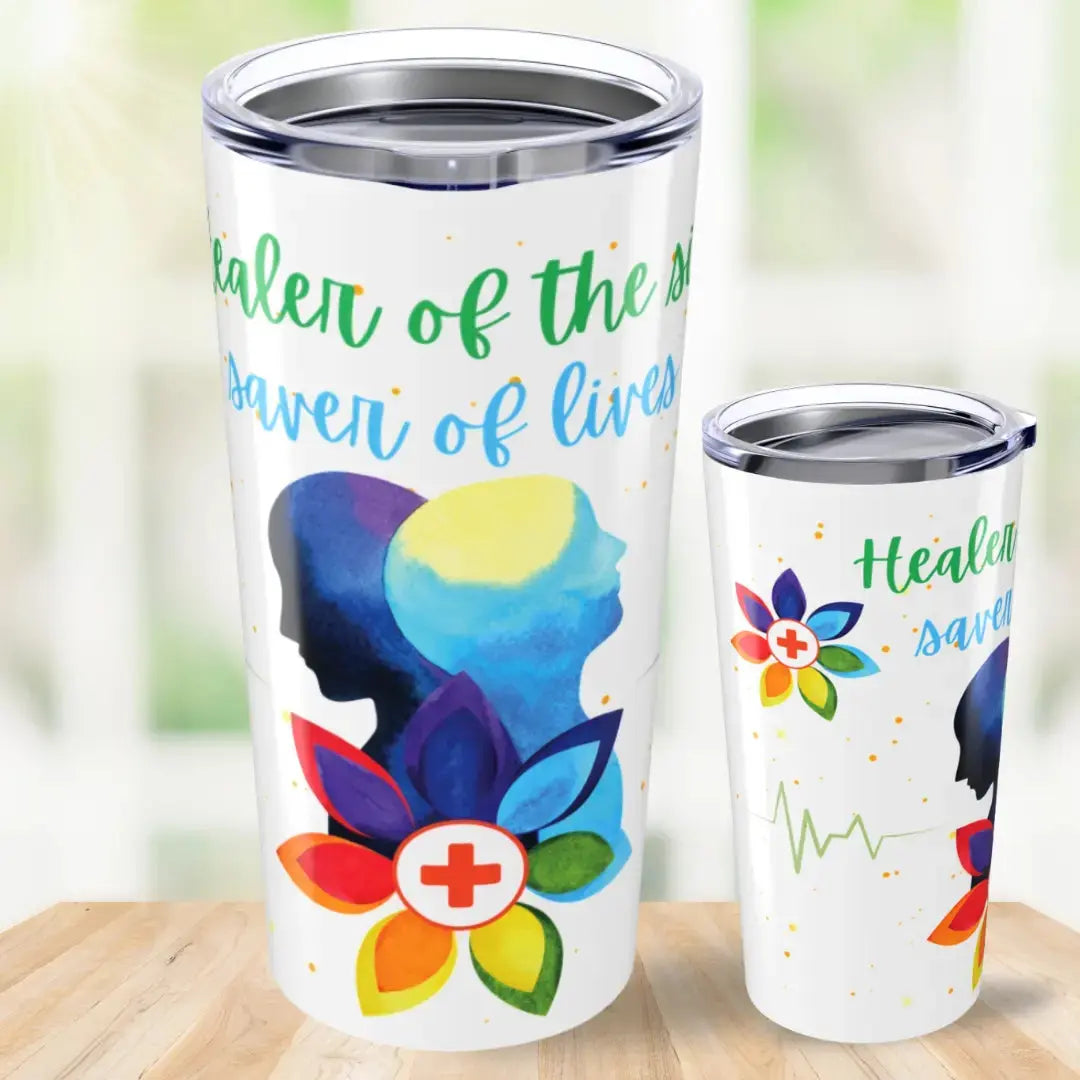 Two tumblers with colorful designs and 'Healer Of The Sick Saver Of Lives' text on a wooden surface.