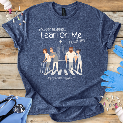 Blue med t-shirt with graphic design and text on a wooden surface with medical accessories.