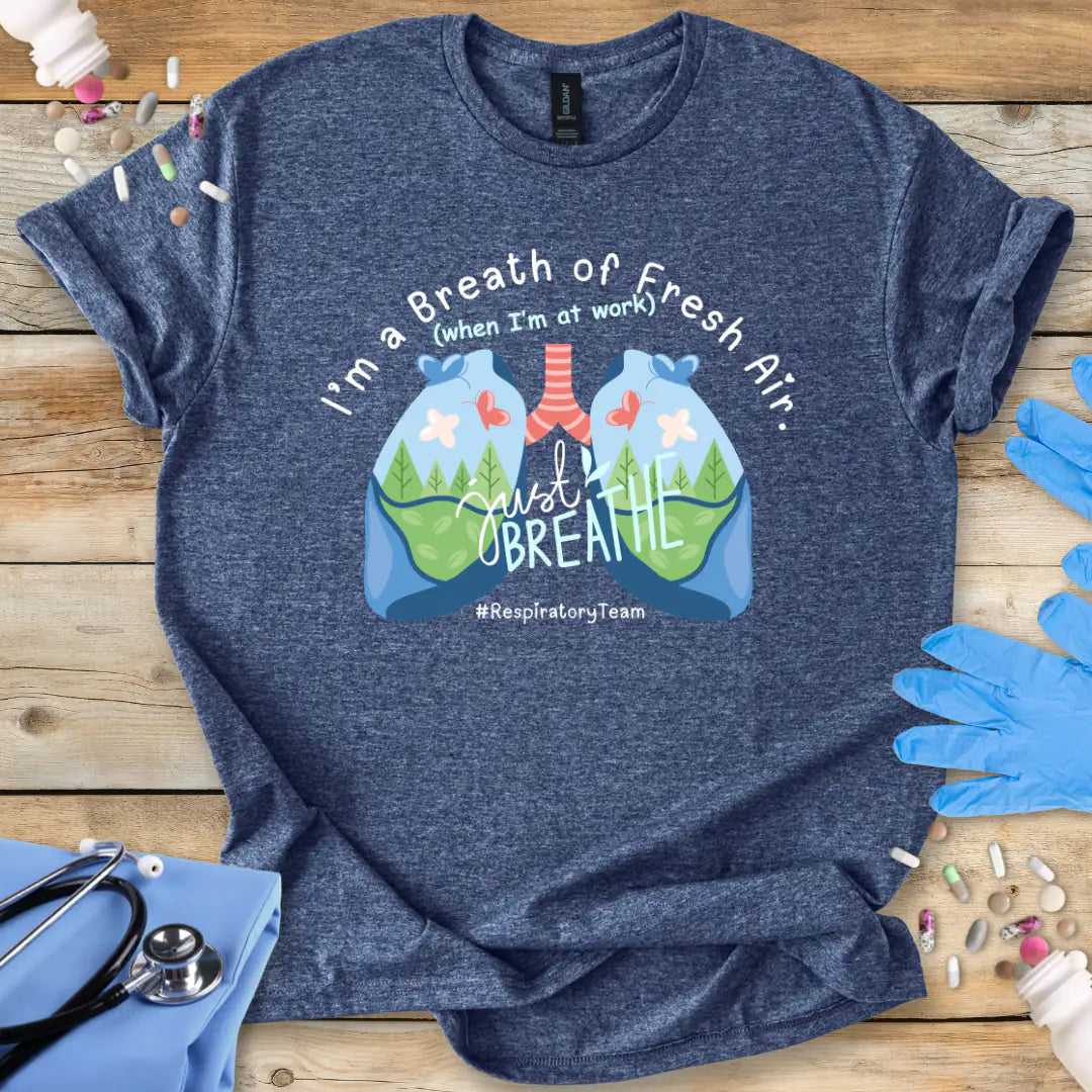 Heather Navy t-shirt with lungs graphic and 'respiratory team' text on a wooden surface with a stethoscope.