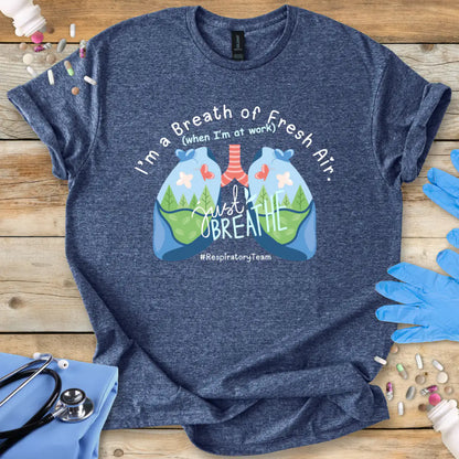 Heather Navy t-shirt with lungs graphic and 'respiratory team' text on a wooden surface with a stethoscope.
