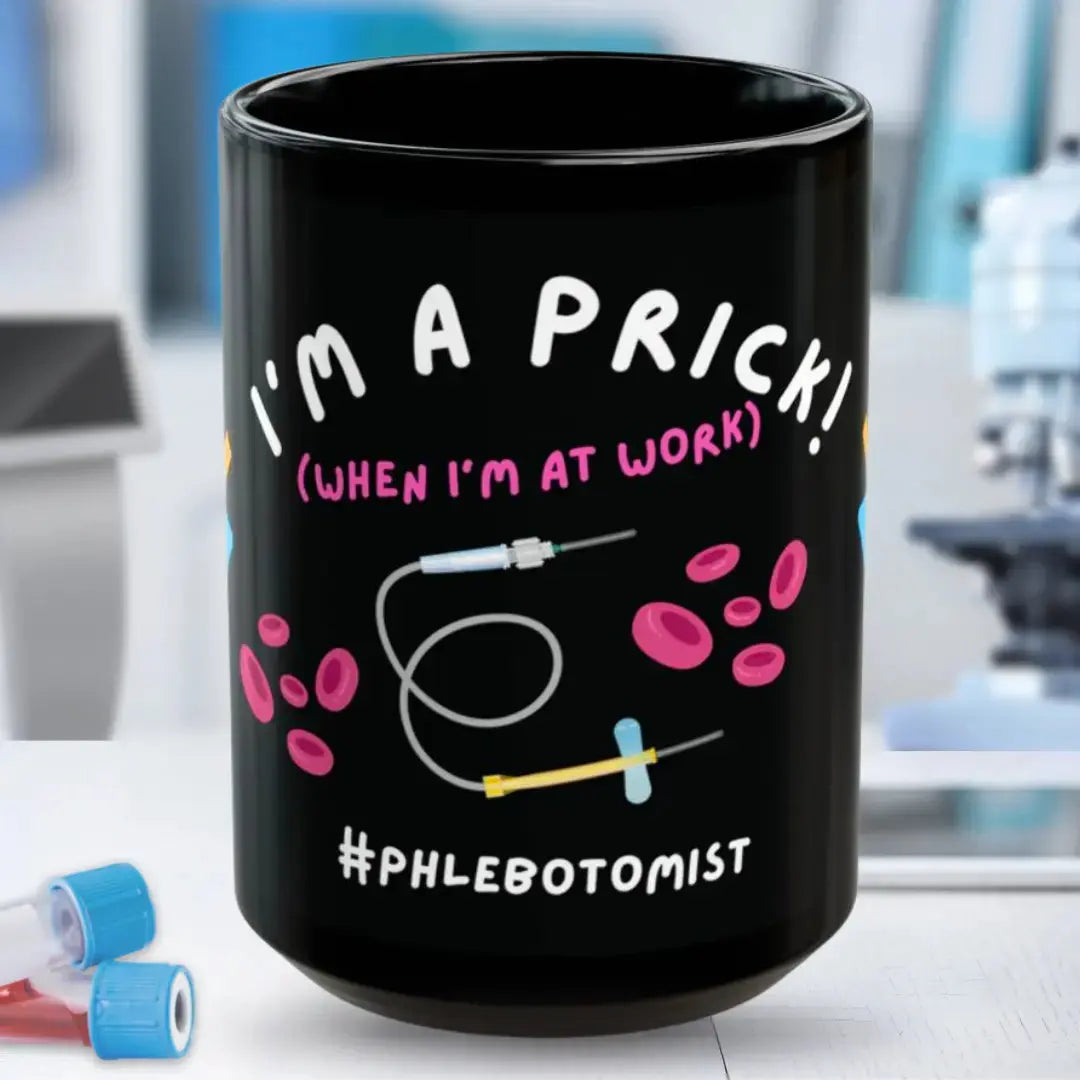 Black mug with 'I'm A Prick When I'm At Work' text and medical graphics on a blurred background