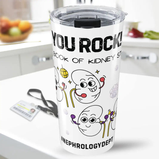Tumbler with cartoon characters and 'You Rock In My Book Of Stones' text on a kitchen counter