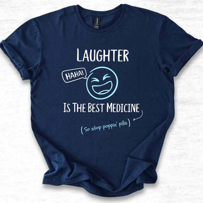 Navy blue t-shirt with humorous 'Laughter is the best medicine' text and smiley face design on a white background